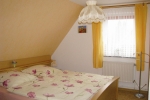 fewo-daschke_ferienhaus-ostseewind-schlafbereich